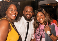 Friends smiling together at BLAQTOBERFEST