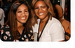 Two attendees smiling together