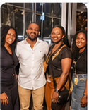 Group smiling together at a BLAQTOBERFEST event